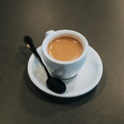 white ceramic cup with brown liquid