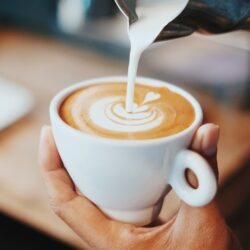 person making latte art